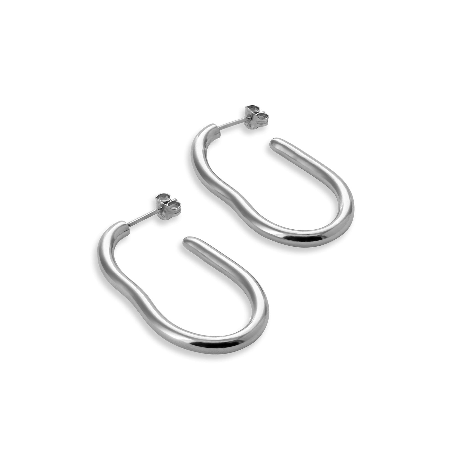 Large silver organic shape hoop earrings on a white background.