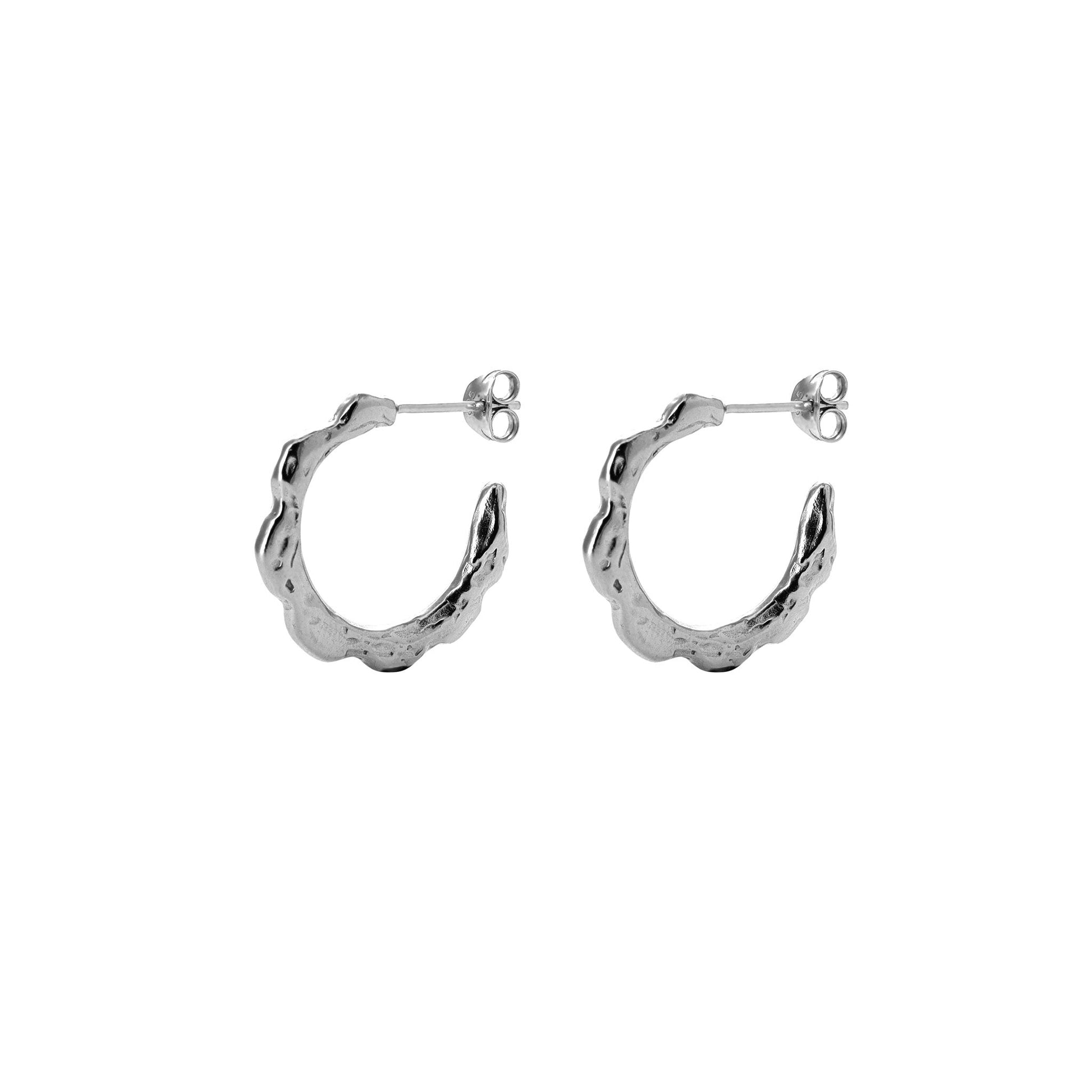 Medium sized silver hoops with organic texture on white background.