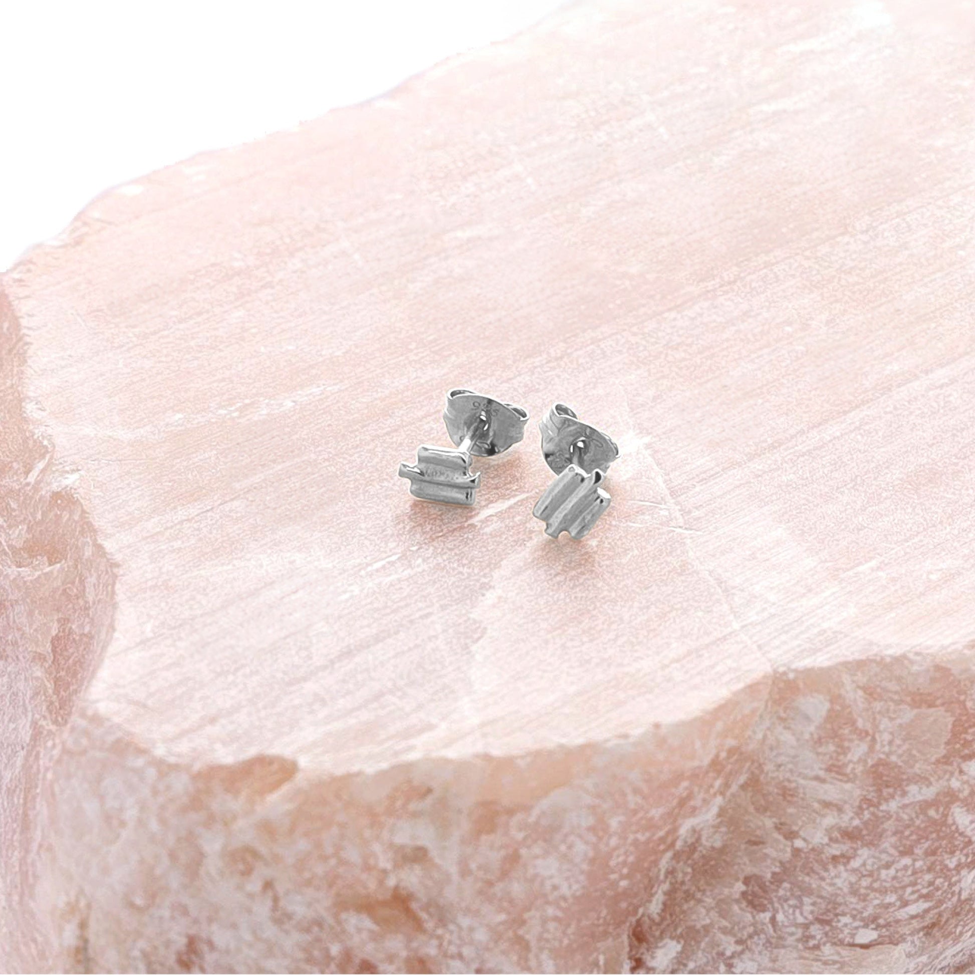 Small silver textured stud earrings.