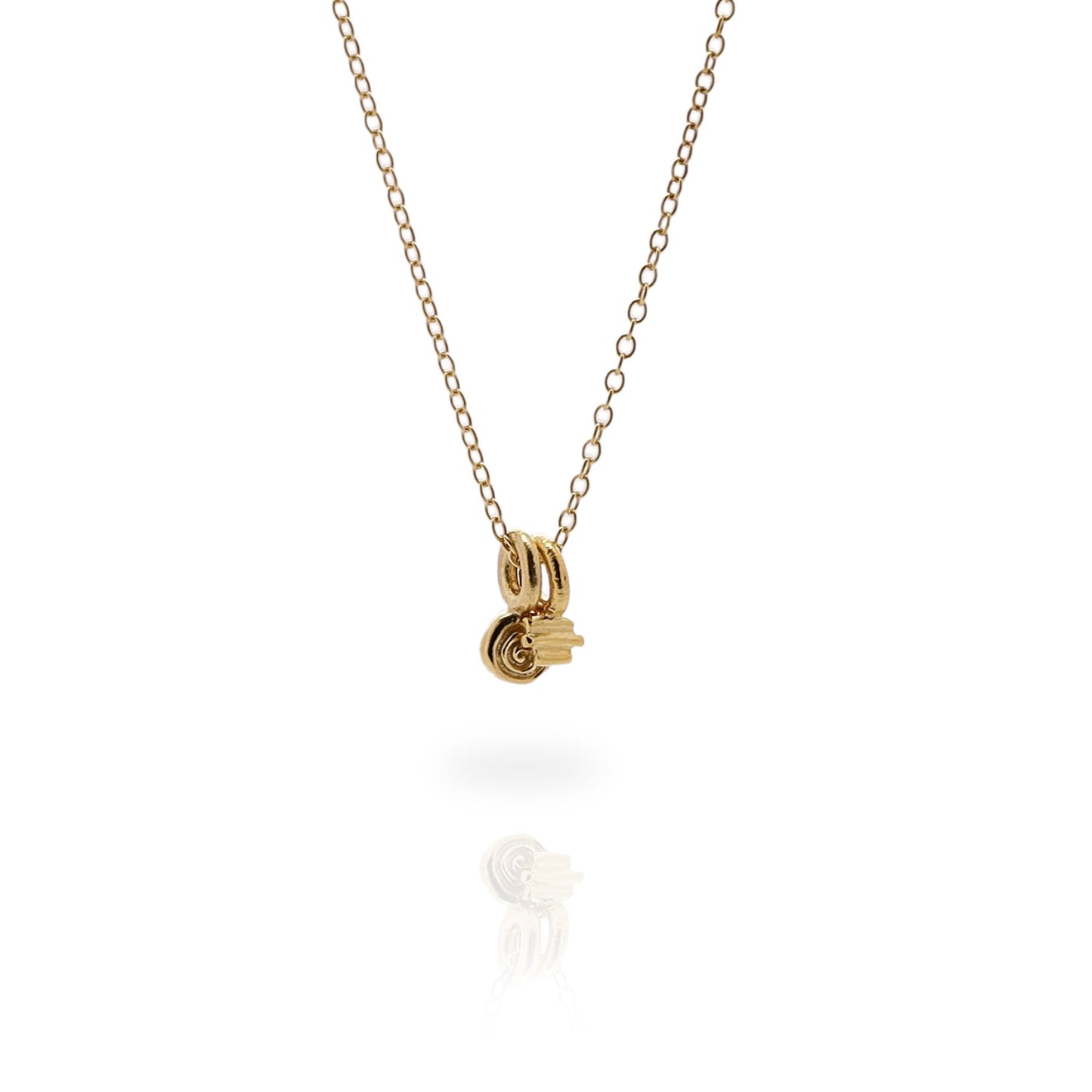 Two small gold charms on a fine gold chain, on a white background.