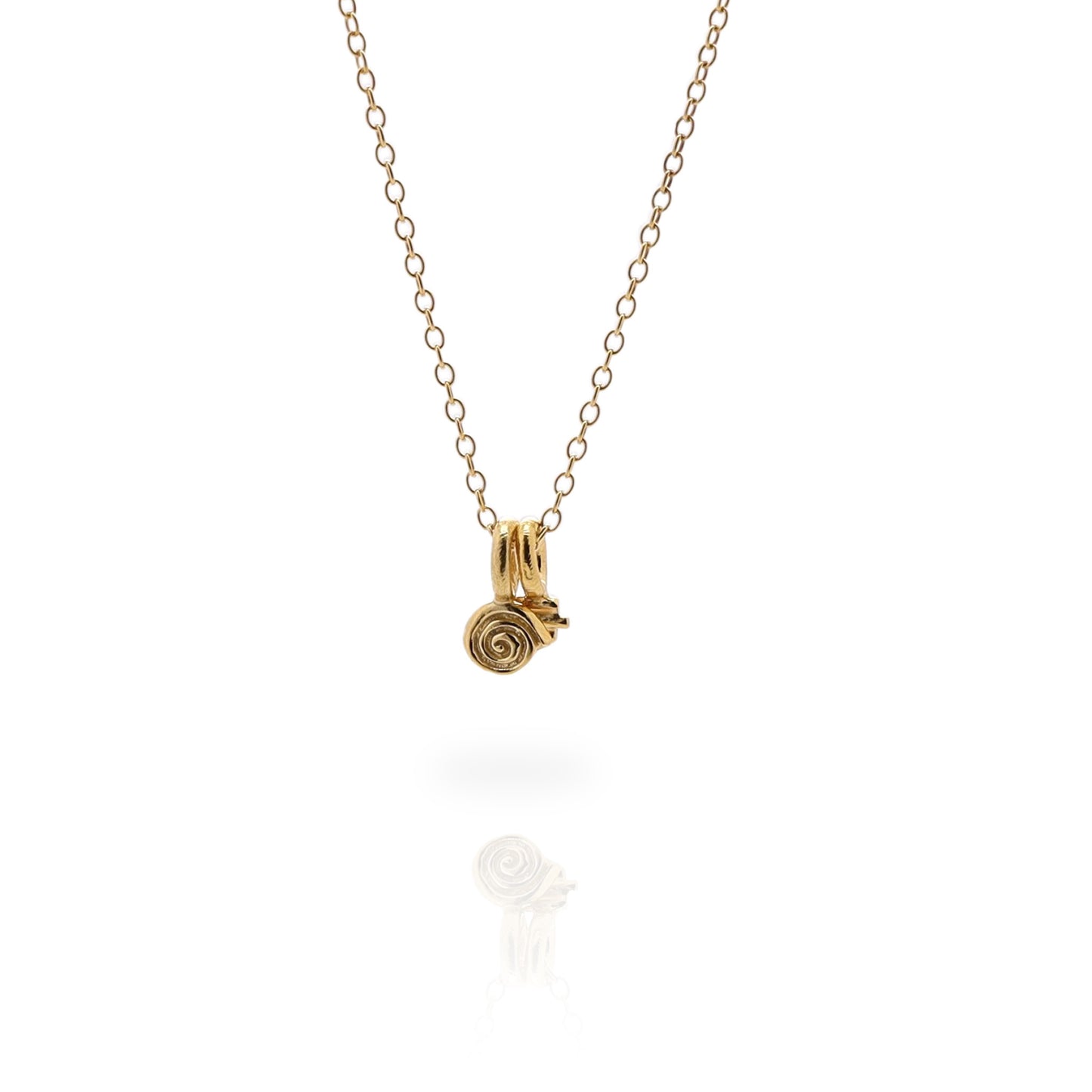 Two small gold charms on a fine gold chain on a white background.