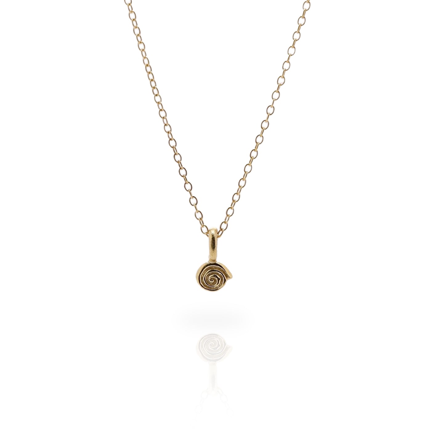 Small gold labyrinth charm on a fine gold chain on a white background.