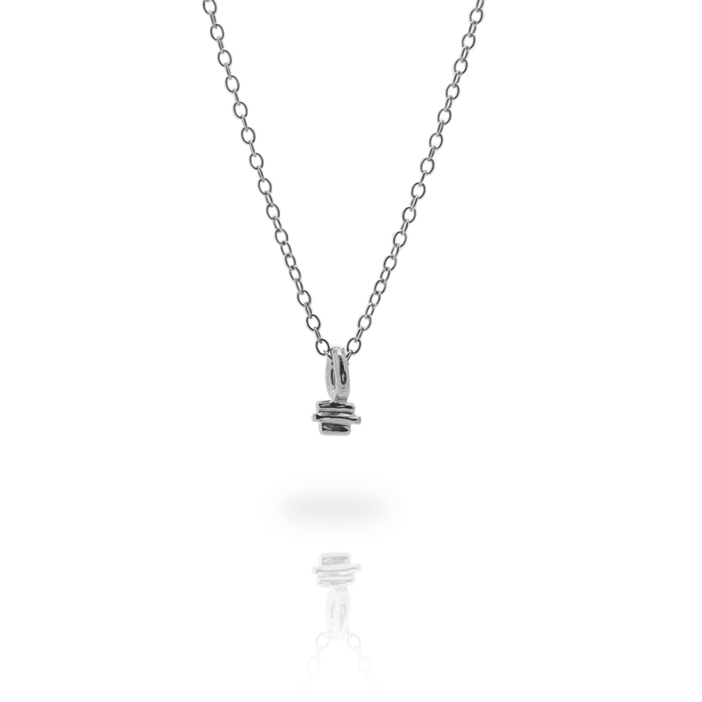 Small silver textured charm on a fine silver chain on a white background. 